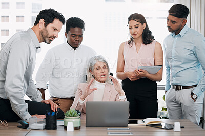 Buy stock photo Shot of a diverse group of businesspeople using a laptop during a meeting in the office
