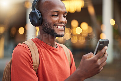 Buy stock photo City, headphones and black man with smartphone, typing and connection with social media, audio and streaming music. Outdoor, radio and male person with a cellphone, mobile app and headset with sound
