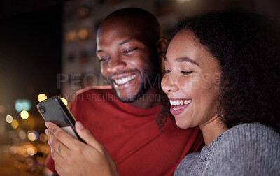 Buy stock photo Phone, social media and funny couple in the city at night for love, freedom or fun together. Face, meme or mobile with a black man and woman in an urban town to enjoy nightlife while bonding