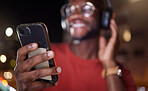 Man hands, phone and music in a city at night with online streaming and audio. Podcast, web radio and internet broadcast with a African male person smile and mobile networking feeling happy with text