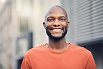 Black man, smile and portrait outdoor on a city street with a positive mindset, confidence and freedom. Face of a happy african person or student on an urban road with casual style for travel