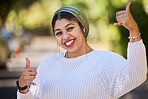 Muslim, thumbs up and portrait of woman student with yes, agreement and okay gesture on university or college campus. Smile, happy and young female person with thank you sign or symbol in a park