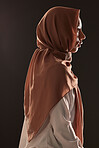 Muslim woman, profile and hijab for religion, islam or praise in faith against a dark studio background. Side view of Islamic female person or model with scarf in fashion for culture or tradition