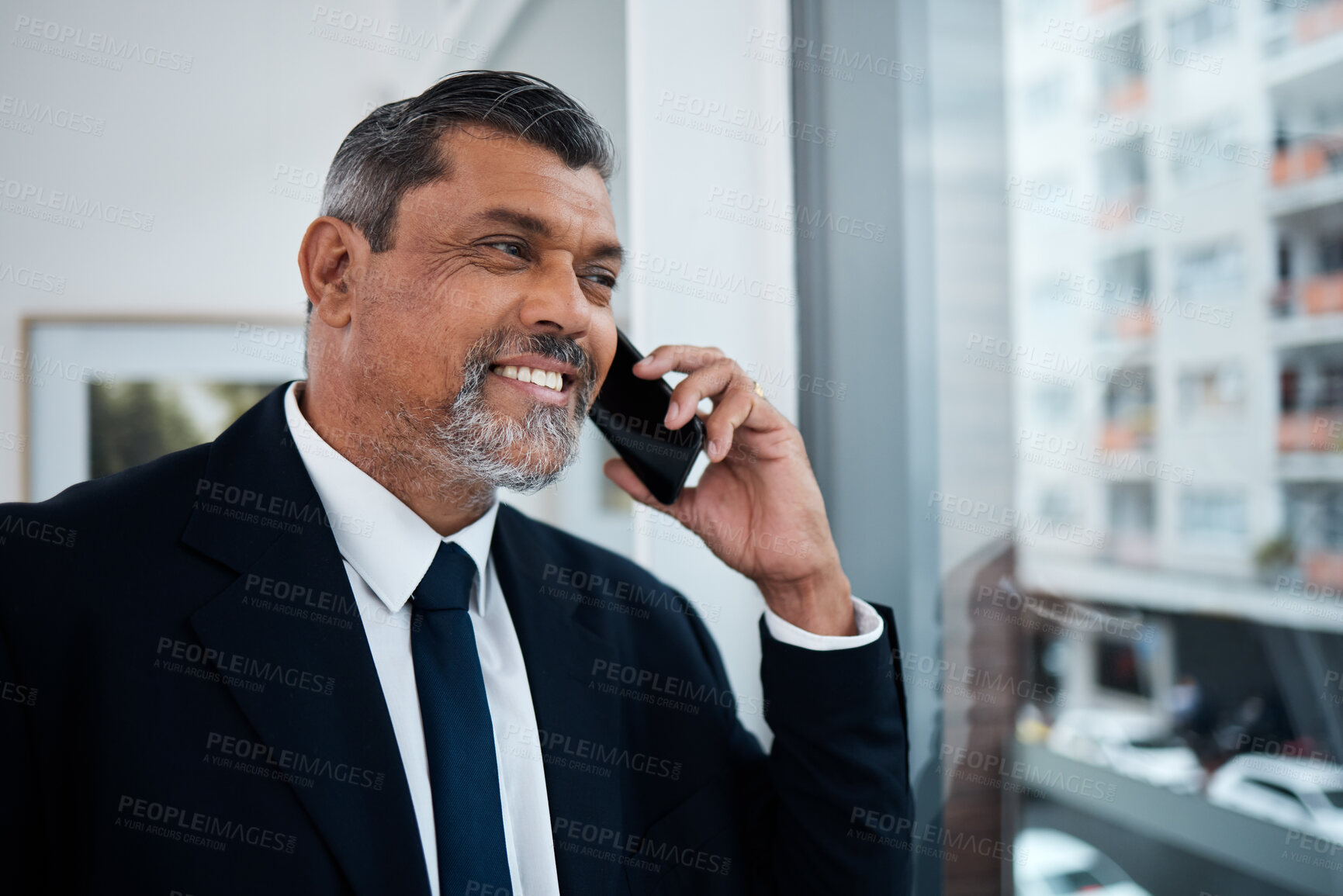 Buy stock photo Happy businessman, phone call and window in office building for communication, networking and discussion. Boss, CEO and executive manager thinking while talking on smartphone conversation in company