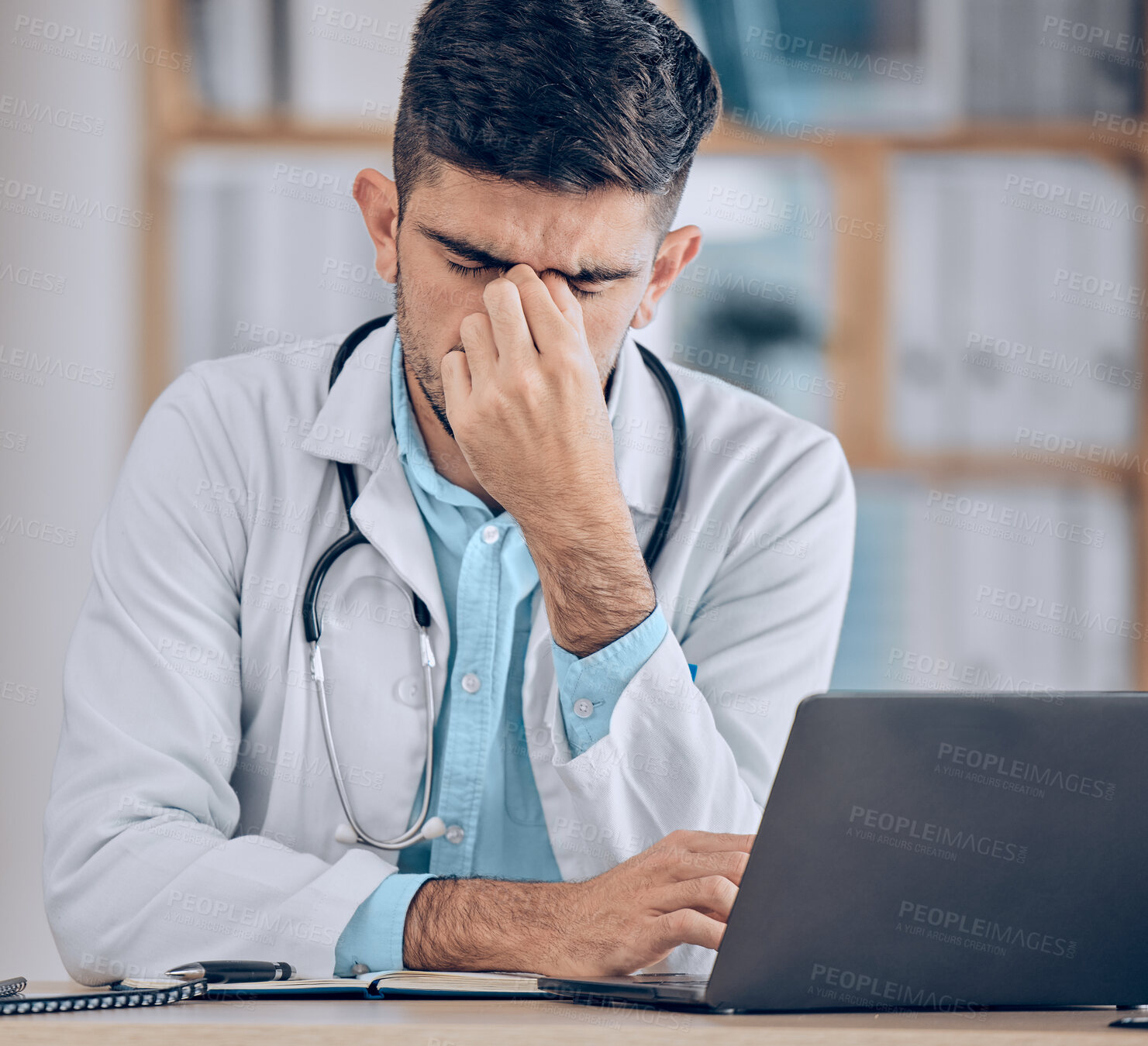 Buy stock photo Man, doctor and headache with laptop in stress, mistake or debt from burnout or deadline at hospital. Frustrated male person or medical employee in anxiety, depression or mental health at the clinic