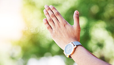 Buy stock photo Hand, time and watch with a person outdoor in nature on a green background for freedom, meditation or zen. Yoga, fitness and wellness with an adult alone in the park, garden or backyard closeup