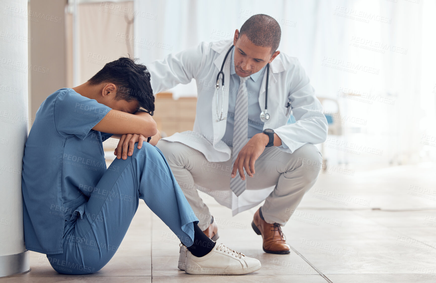 Buy stock photo Sad nurse on floor and doctor support, helping or empathy for healthcare fail, mental health and stress or anxiety. Tired, fatigue and mentor or medical people with depression in hospital or clinic