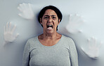 Portrait, screaming and senior woman with stress, depression and frustrated with mental health. Angry face, female person and model with anxiety, horror and psychology problem on a studio background