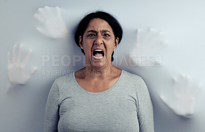 Buy stock photo Portrait, screaming and senior woman with stress, depression and frustrated with mental health or fear. Angry face, female person and model with anxiety, horror and psychology on a studio background