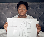 Portrait, sign and black woman with depression, sad and anxiety in home bedroom. Mental health, face and African person with poster for stress, challenge and life crisis, frustrated and in denial