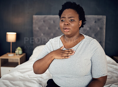 Fear, sick and a black woman with an anxiety attack or pain in chest from stress. Scary, health and an African girl on a bed with panic, depression or a mental health problem or fail in the bedroom