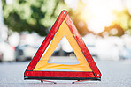 Red triangle, road sign and stop for emergency, construction or symbol for caution to driver on the ground, floor or street. Attention, warning and signal to traffic of an accident or problem