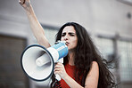 Megaphone, woman and shouting for social change, justice for equality and humanity with activist on street, stand up and strike. Young female, protester and girl with bullhorn, protesting for freedom