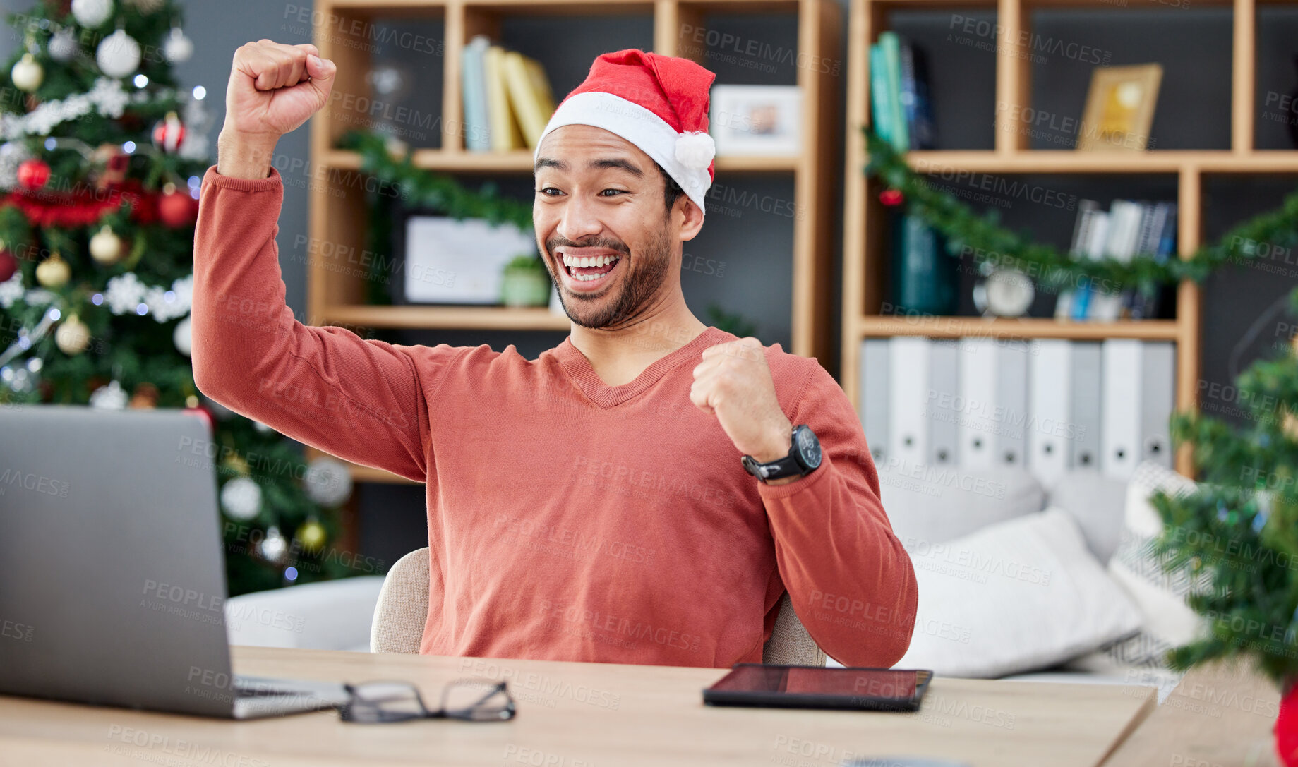 Buy stock photo Laptop, christmas and remote work with a winner man in his home office for the celebration of an achievement. Computer, success and motivation with a happy entrepreneur cheering a sale, bonus or deal