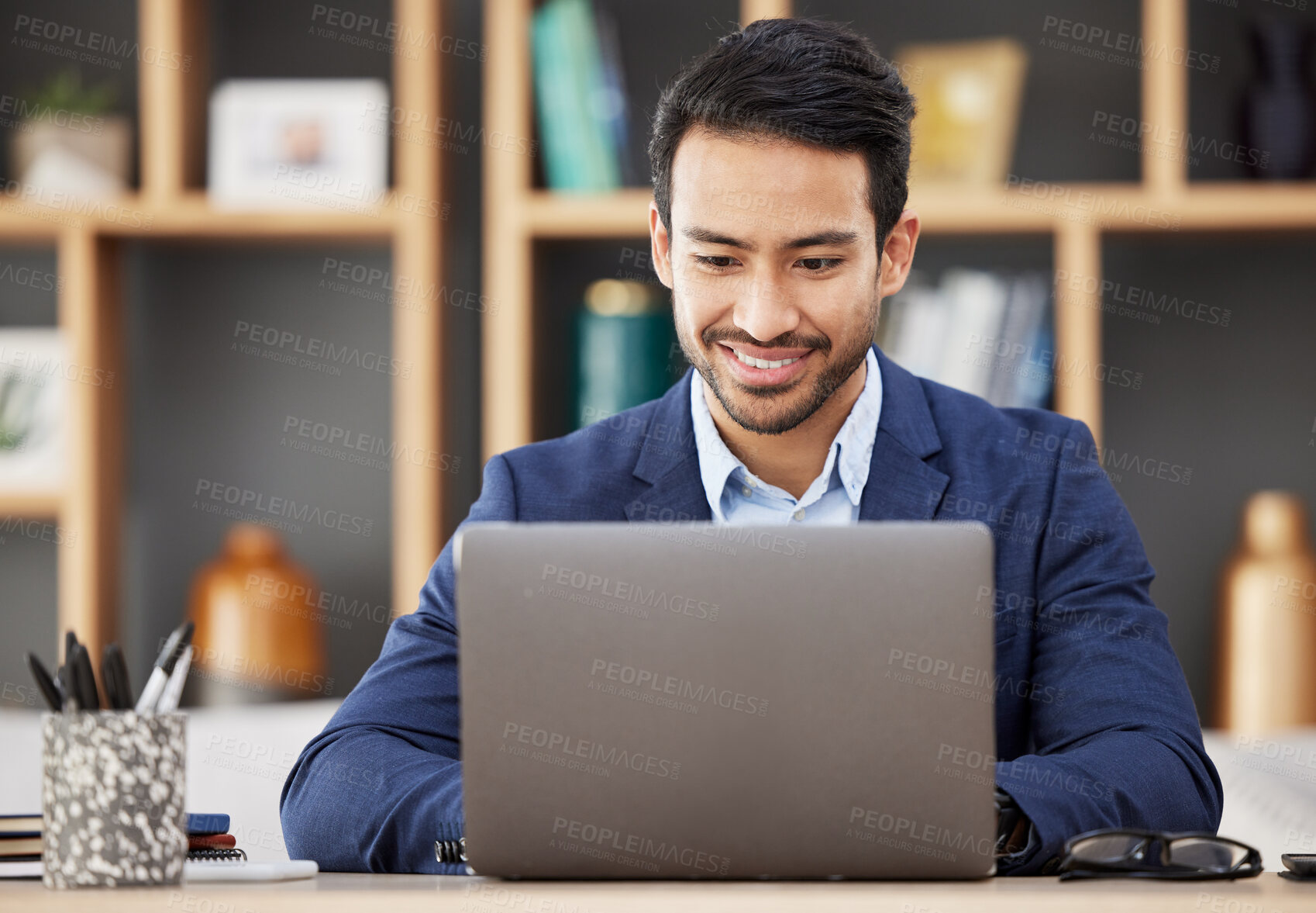 Buy stock photo Man in office with laptop, smile and typing email, proposal or writing online report networking at startup. Happy businessman, computer and administration work for editing, copywriting or web search.