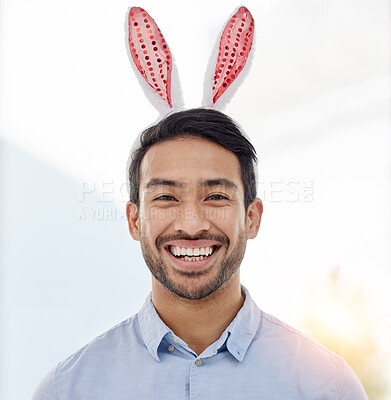 Buy stock photo Bunny ears, holiday and business man portrait with a smile from easter and creative job pride. Celebration, happy and male professional from Spain feeling silly and goofy with comedy hat at office