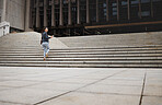 Walking, city and business woman on building stairs with coffee for morning commute, journey and travel. Professional, worker and female person with drink for career, work and job in urban town