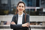 Business woman, professional portrait and arms crossed outdoor with a smile and creative job pride. City, entrepreneur and work commute in morning with female person from New York in urban town
