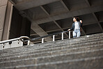 Walking, coffee and business woman on stairs in city for morning commute, journey and travel. Professional, worker and female person with drink for career, work and job in urban town by building