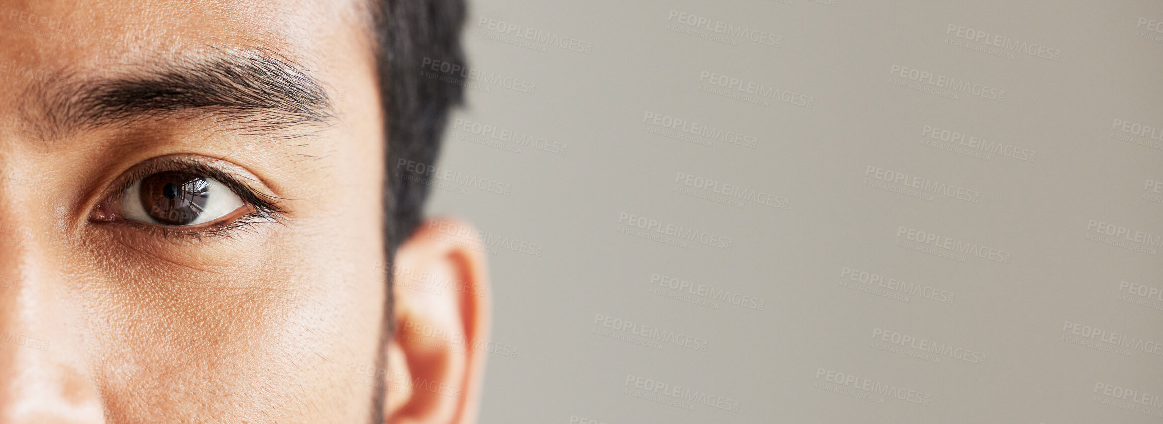 Buy stock photo Eye banner, portrait and man for optometry, vision and mockup for healthcare advertising. Half face, closeup and person on a backdrop with space for anatomy, focus and marketing of contact lenses