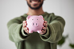 Finance, investment or hands of man with piggy bank for financial wealth growth or savings increase. Closeup, income or person holding profit earnings budget in tin for safety or insurance security 