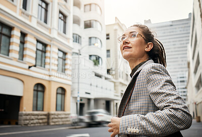 Buy stock photo Professional woman in city, travel and commute to work with buildings, motion blur and waiting for taxi cab. Corporate female person in urban street, business clothes and journey to workplace