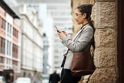 Buy stock photo City wall, phone and business woman typing online research, reading email and scroll on website, app or social media. Urban sidewalk, cellphone and professional person relax on outdoor work break