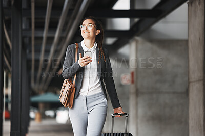 Buy stock photo Phone, vision and luggage with a business woman walking in an airport parking lot outdoor in the city. Mobile, suitcase and travel with a young female professional on an international trip for work