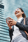 Phone, smile and business woman in city from below for location, search and walking on building background. Smartphone, social media and lady online for map, networking and travel text communication