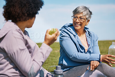 Buy stock photo Talking, exercise and senior women friends on the grass outdoor taking a break from their workout routine. Fitness, training and healthy eating with elderly people chatting on a field for wellness