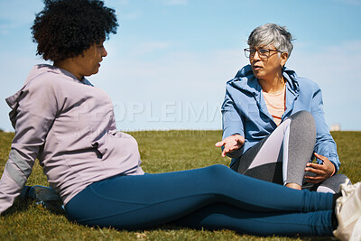 Buy stock photo Talking, fitness and senior women friends on the grass outdoor taking a break from their workout routine. Exercise, training and summer with elderly people in conversation on a field for wellness