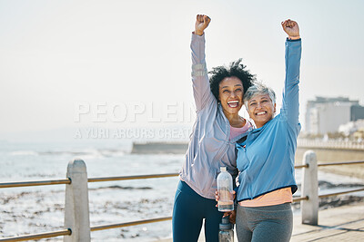 Buy stock photo Success, women and friends, fist pump and fitness goals with running outdoor, winning and health. Happy senior female people, exercise achievement while training for marathon with cheers at beach