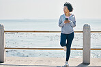 Relax, phone and fitness with black woman at beach for running, workout and tracking app. Network, communication and contact with female runner training in nature for technology, sports and mobile