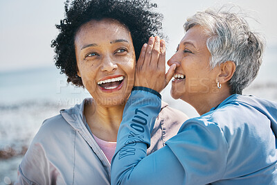 Buy stock photo Gossip, outdoor and senior friends with a secret, whisper or talking in ear for a funny joke after beach exercise. Laughing, crazy and elderly women listening to conversation or story at the sea