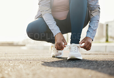 Buy stock photo Fitness, runner and woman tie shoes outdoor in the road for running workout in the city. Sports, health and closeup of female athlete tying her laces for cardio exercise for race or marathon training