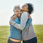 Hugging, fitness and senior women bonding together in an outdoor park after a workout or exercise. Happy, smile and elderly female friends or athletes with love and care after training in nature.