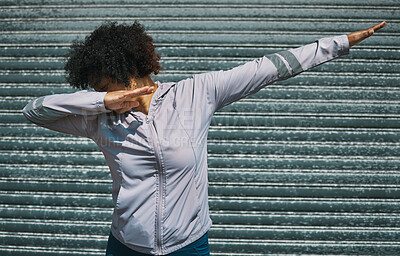 Buy stock photo Dabbing, dance and a person on a city wall for hip hop, celebration or fitness. Urban, sports and a female athlete moving for workout, exercise success or training in a town for outdoor cardio