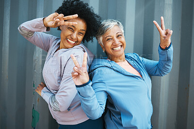 Buy stock photo Fitness, portrait and senior friends with peace sign bonding and posing after workout or exercise together. Happy, fitness and elderly female athletes with hipster hand gesture after training by wall
