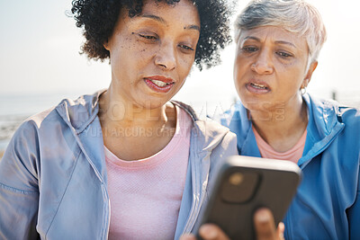 Buy stock photo Phone, confused and senior friends on the beach together, browsing social media or reading a text message. Communication, summer and elderly women on the coast with a mobile to search for information