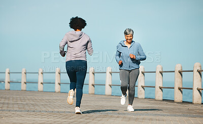 Buy stock photo Running, fitness and senior friends by sea with mature women and smile from marathon. Exercise, workout and training on beach promenade path for health and wellness in the morning with happy people