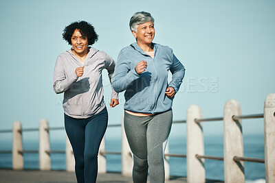 Buy stock photo Fitness, running and senior women at beach for health, wellness and exercise in nature together. Elderly, friends and ladies at sea happy, workout and active retirement, fun and bonding ocean run