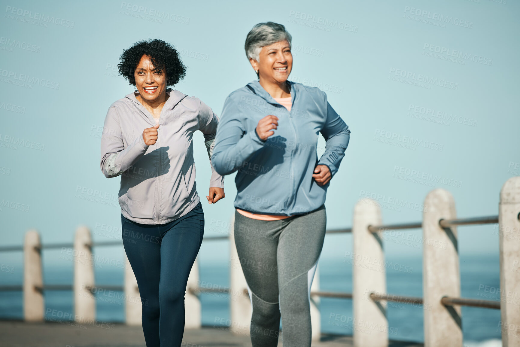 Buy stock photo Fitness, running and senior women at beach for health, wellness and exercise in nature together. Elderly, friends and ladies at sea happy, workout and active retirement, fun and bonding ocean run