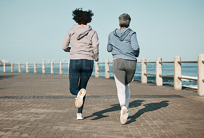Buy stock photo Back view, beach and friends running for fitness together as morning exercise for wellness and outdoor bonding. Health, endurance and people training for marathon in Cape Town for sports workout 