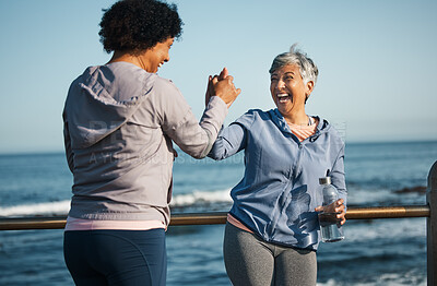Buy stock photo Fitness, high five and senior women friends at beach with exercise, celebration and excited in nature. Sport, people and elderly females with hands in support of wellness, training or success at sea