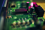 Computer motherboard, closeup and programming with microchip, innovation or it development in laboratory. Information technology, circuit board or electronics for engineering, hardware or maintenance