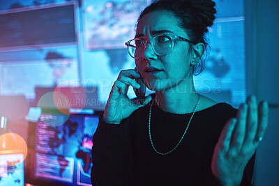 Buy stock photo Night, angry and a woman hacker on a phone call during a cyber security emergency in her office. Communication, software problem and dark with a female programmer talking about information technology
