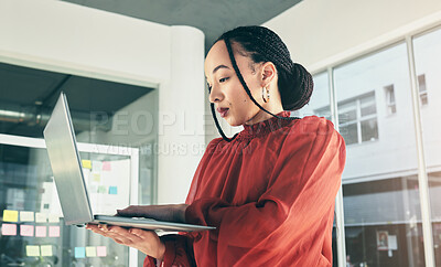 Buy stock photo Woman in office with laptop, research and website for ideas at window, website for business plan and brainstorming startup proposal. Thinking, typing and businesswoman on computer for internet search