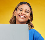 Smile, laptop and portrait of woman on yellow background, networking and online influencer with internet connection. Computer, studio and face of happy content creator with social media, email or web