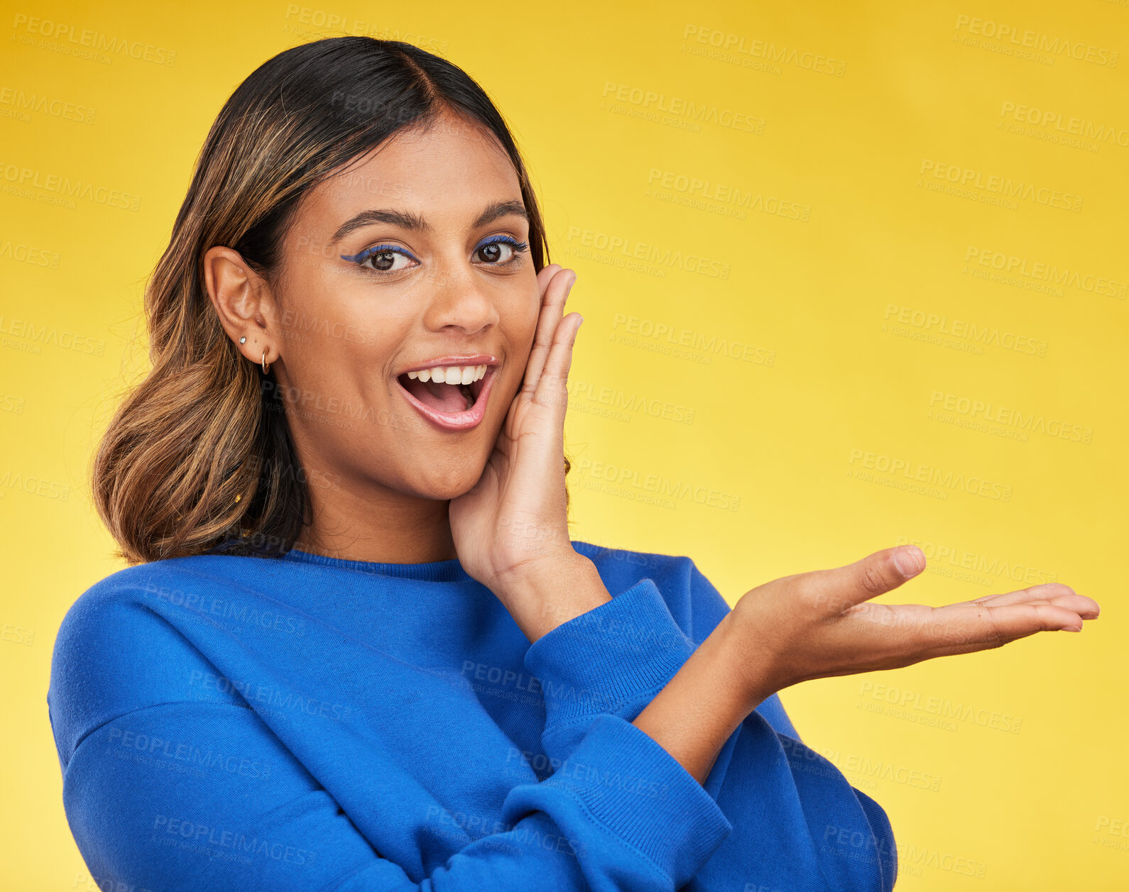 Buy stock photo Portrait, showing and woman excited, surprise and happiness on a yellow studio background. Face, female person or model with shock, wow and omg with mockup space, emoji and smile with gesture or deal