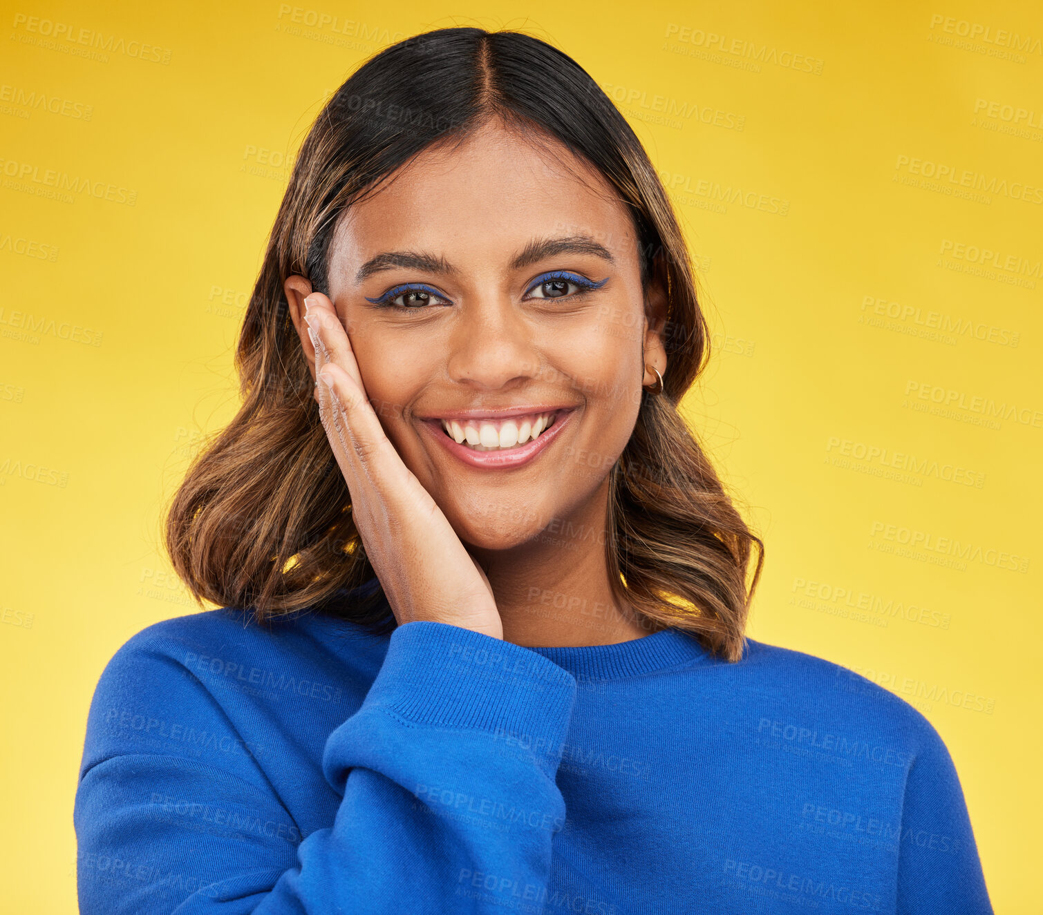 Buy stock photo Portrait, smile and skincare with a woman on a yellow background in studio for fashion or cosmetics. Face, makeup and a happy young female model posing indoor in a trendy outfit for clothes style